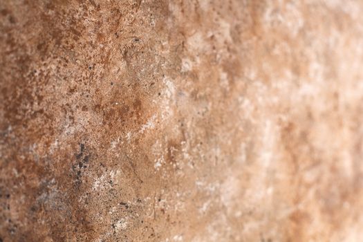 Concrete beige brown black background with scuffs and splashes. Textured wall texture in the grunge style with soft focus. Space for text