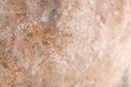 Concrete beige brown black background with scuffs and splashes. Textured wall texture in the grunge style with soft focus. Space for text