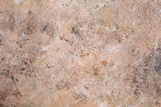Concrete beige brown black background with scuffs and splashes. Textured wall texture in the grunge style with soft focus. Space for text