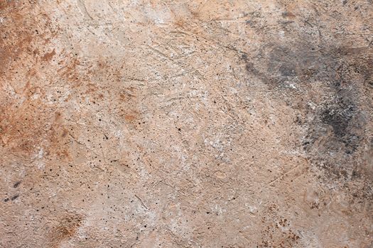 Concrete beige brown black background with scuffs and splashes. Textured wall texture in the grunge style with soft focus. Space for text