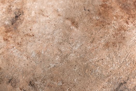 Concrete beige brown black background with scuffs and splashes. Textured wall texture in the grunge style with soft focus. Space for text