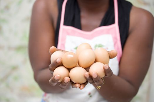 close up of woman hands with organic eggs in hands