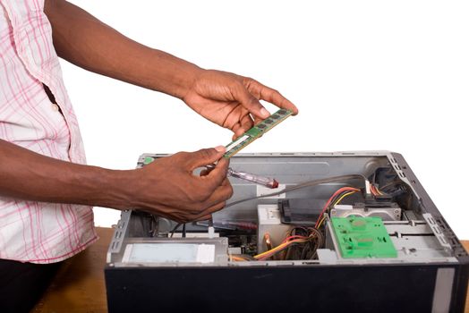 closeup of technician hands repairing a computer while holding a memory pad isolated on white background