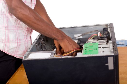 interior of an open computer being repaired by a man