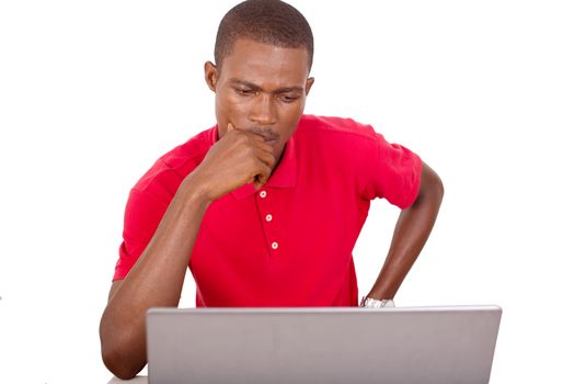 young businessman working at the office with computer and thinking about a project