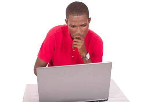 young businessman working at the office with computer and thinking about a project