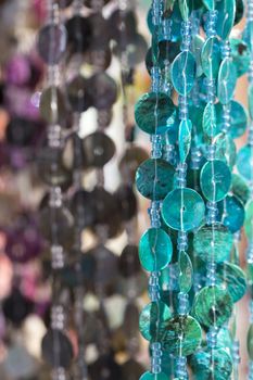 Colorful chains of plastic discs for room decoration