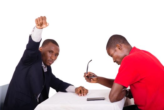 Young man sitting with his friend ordering food in a restaurant on white background.