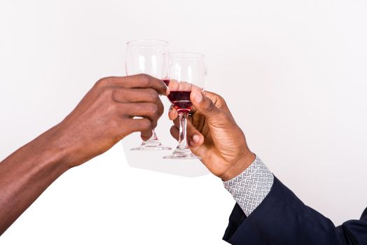 businessmen clinking wine glasses on white background