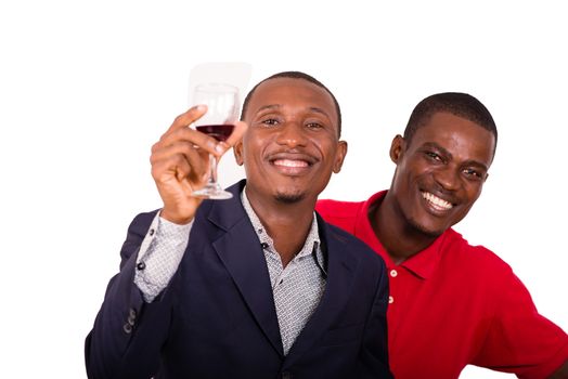 Young happy people toasting with wine for a party in studio on a white background