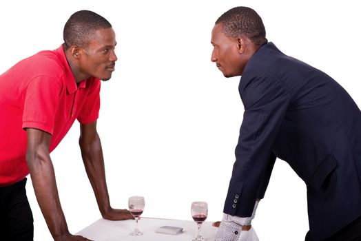 Two businessmen looking at each other with tension. Rivalry of business people.