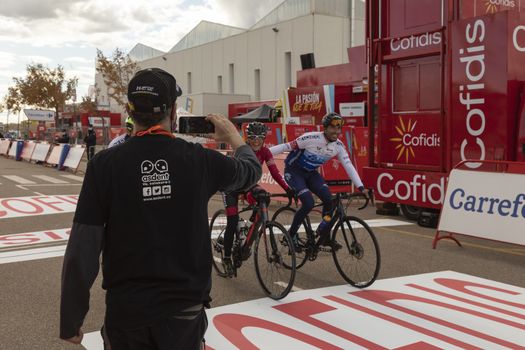 Staff and workers of the organization of the race and the cycling tour, in the finish area of the fourth stage of La Vuelta a España 2020.