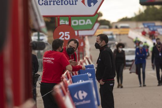 Staff and workers of the organization of the race and the cycling tour, in the finish area of the fourth stage of La Vuelta a España 2020.