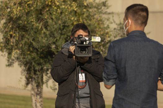 Journalists, photographers and media, working in the finish line area of the fourth stage of La Vuelta a España 2020.