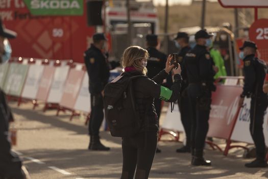 Staff and workers of the organization of the race and the cycling tour, in the finish area of the fourth stage of La Vuelta a España 2020.