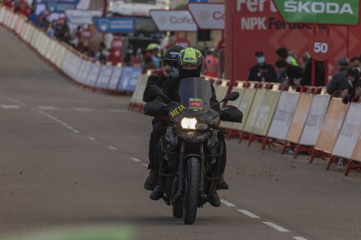 Staff and workers of the organization of the race and the cycling tour, in the finish area of the fourth stage of La Vuelta a España 2020.