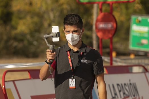 Staff and workers of the organization of the race and the cycling tour, in the finish area of the fourth stage of La Vuelta a España 2020.