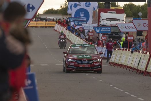 Arrival safety car of the cyclists peloton, in the area of the finish line of the fourth stage of La Vuelta a España 2020.