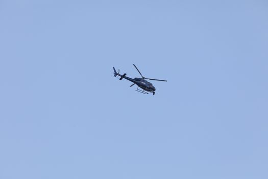 Television helicopter in information and broadcasting tasks, in the area of the finish line of the fourth stage of La Vuelta a España 2020.