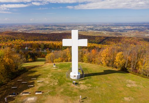 Aerial drone view of the metal structure of the Great Cross of Christ on Dunbar's Knob in Jumonville, PA