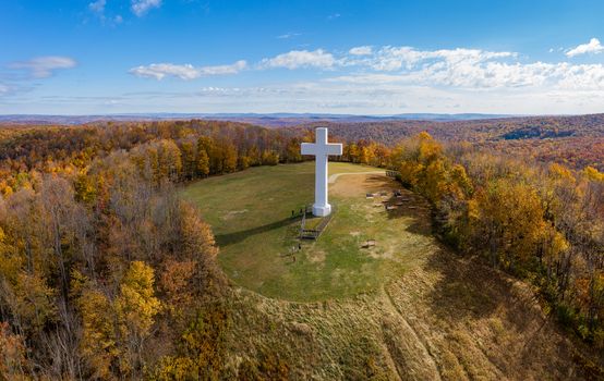 Aerial drone view of the metal structure of the Great Cross of Christ on Dunbar's Knob in Jumonville, PA