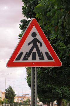 Student school crossing sign on the vehicle road,