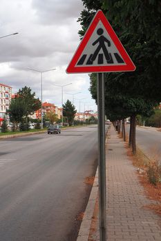 Student school crossing sign on the vehicle road,