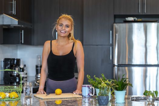 A gorgeous blonde model prepares a meal before heading to work