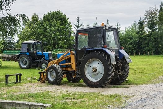 Belarus, Minsk - July 11, 2017: two wheeled tractors Belarus on a farmstead