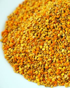 a plateful of bee pollen, close-up bee flower pollen grains,