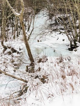 Frozen waterfall and icicles in a beautiful landscape in Norway.