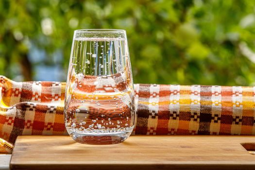 A glass of water in the garden background