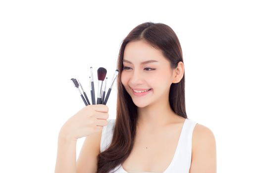Beauty asian woman applying make up with brush on hand isolated on white background, beautiful of girl holding blusher, skincare and cosmetic concept.
