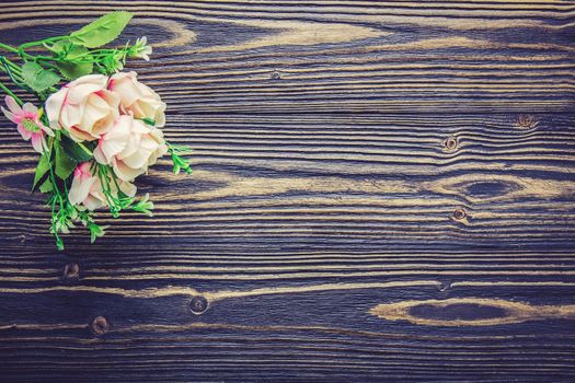 Bouquet of flower and empty rustic wooden table with copy space, table empty with flower romantic, top view, vintage retro style.