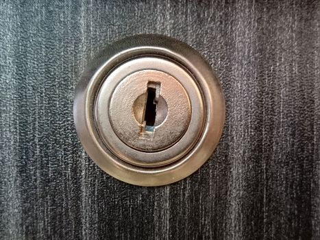 lock and key closeup on wooden board for sell