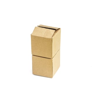 Two square cardboard boxes stand one on top of another on a white background