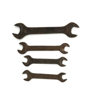 Hand tools. Carob keys of different size, white background