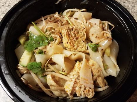 bowl of asian tofu and spicy noodles and vegetables