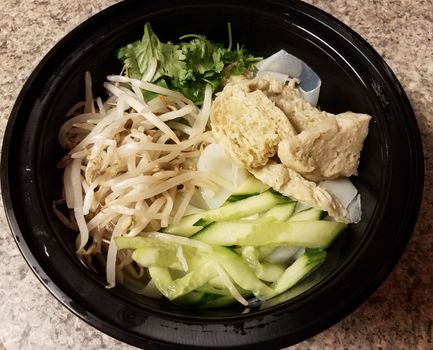 bowl of asian tofu and noodles and vegetables