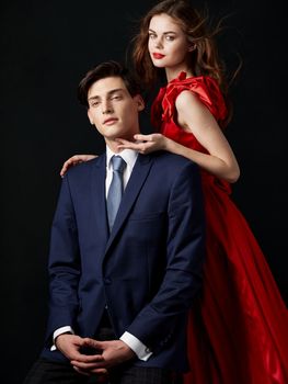 Charming couple man in suit woman in red dress relationship romance portrait family