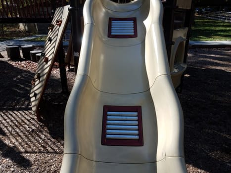 metal rollers on plastic playground slide to make it faster