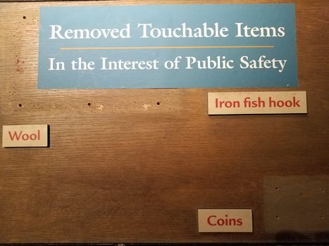 removed touchable items for public safety wood sign