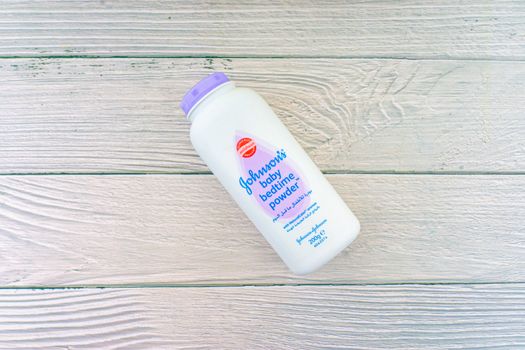 Kuala Lumpur, Malaysia - October 19, 2020 : Johnson and Johnson Baby bedtime powder talcum on wooden background