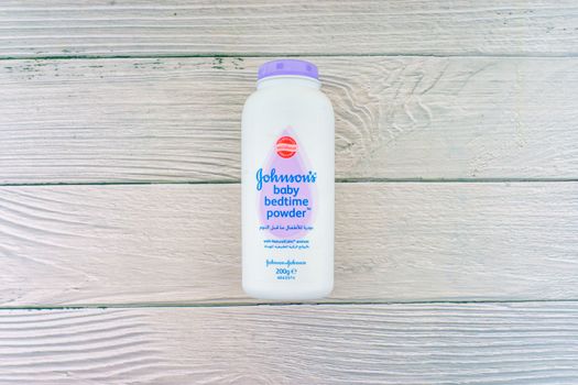 Kuala Lumpur, Malaysia - October 19, 2020 : Johnson and Johnson Baby bedtime powder talcum on wooden background