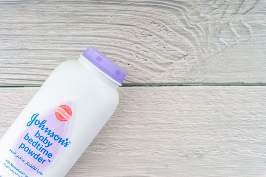 Kuala Lumpur, Malaysia - October 19, 2020 : Johnson and Johnson Baby bedtime powder talcum on wooden background