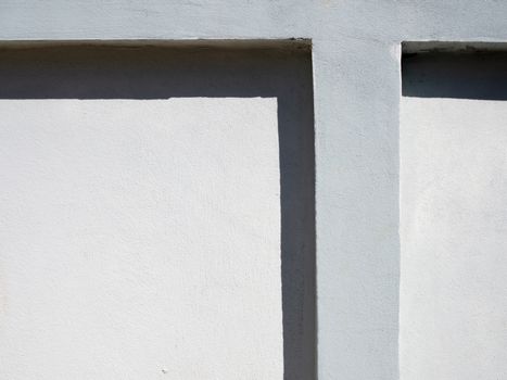 White cement wall fence empty There are light and shadow contrasting on the wall.