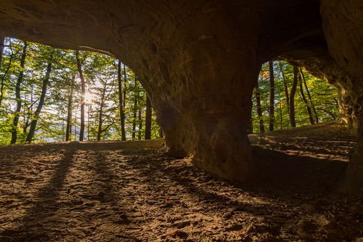 Leisurely hike at the golden hour to the famous Heidenhoehlen near Stockach on Lake Constance