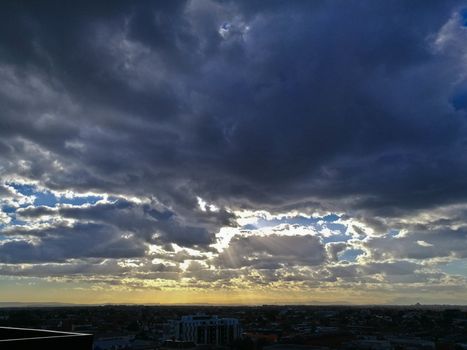 Holy ray of light from heaven above Melbourne Australia skyline cityscape scene
