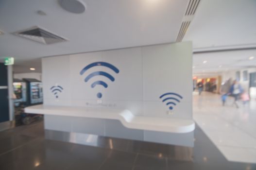 Blurry scene of Airport free wi-fi signs for passengers in the airport