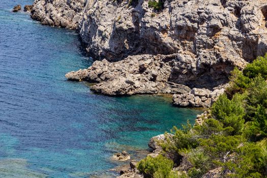 Bay on the peninsula La Victoria, Mallorca with rock in the water and rocky coastline